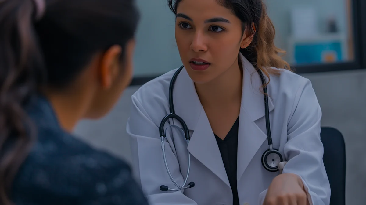 A clinician listening closely to a patient.